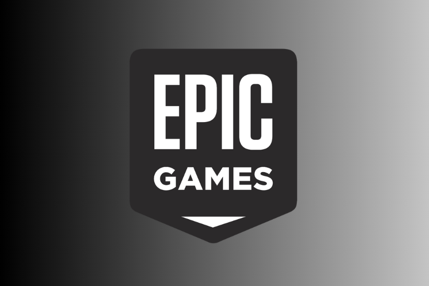 Schwarz-weißes Epic-Games-Logo in Schildform mit den Schriftzügen „EPIC“ und „GAMES“, platziert vor einem Hintergrund mit schwarzem bis grauem Farbverlauf.