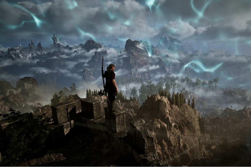 Spielfigur steht auf einer Burgmauer und blickt über eine neblige Berglandschaft mit mystischen Lichteffekten im Gothic 1 Remake