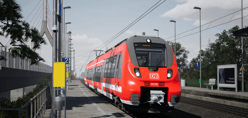 **Alt-Text:** Roter DB-Regionalzug steht an einem Bahnsteig in einer realistisch dargestellten Train Sim World Szene.