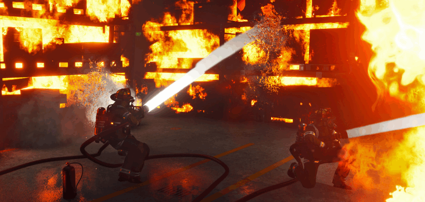 Firefighting Simulator – The Squad mit Feuerwehrleuten beim Löschen eines großen Lagerhallenbrands.