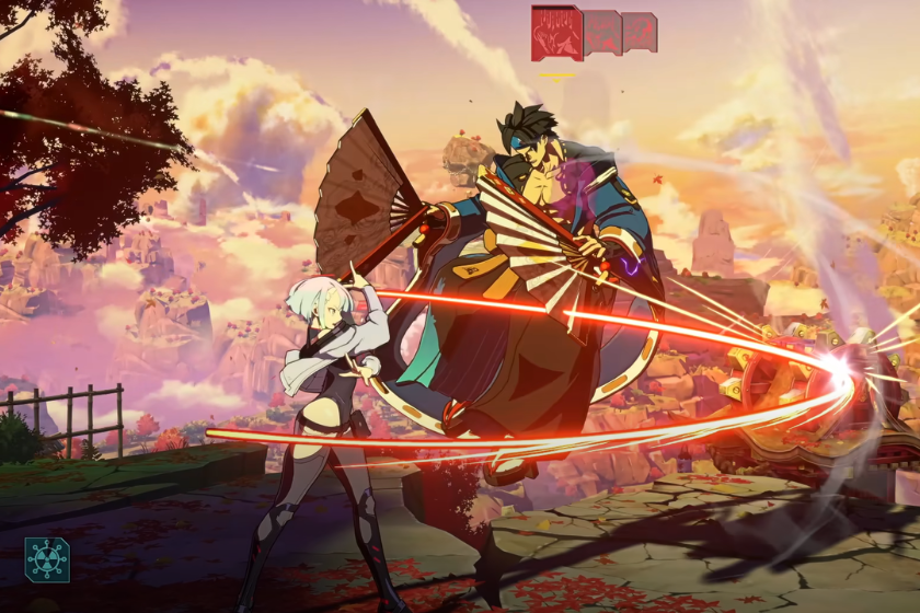 Kampfszene aus GUILTY GEAR -STRIVE- mit einer weißhaarigen Kämpferin gegen einen Gegner mit Fächern.