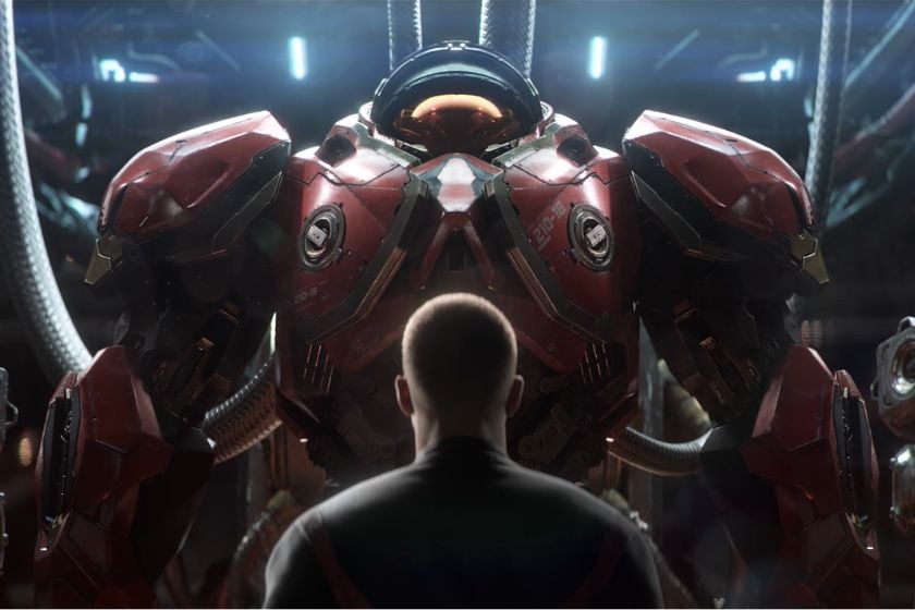Ein StarCraft-Rekrut steht vor einer großen roten Kampfrüstung.