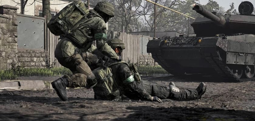 Ein Soldat hilft einem verwundeten Teamkollegen in WARDOGS auf, während im Hintergrund ein Panzer steht.