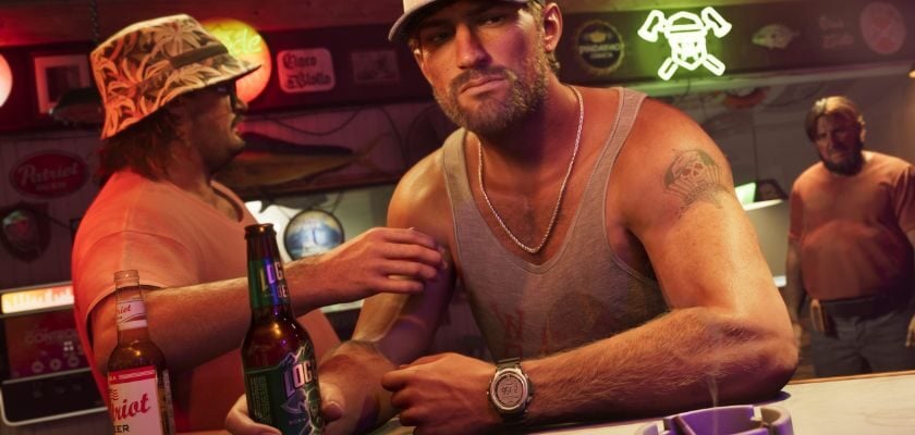 Jason aus GTA 6 sitzt mit einer Bierflasche an einer Bar. Neben ihm stehen zwei weitere Männer in einer schummrig beleuchteten Kneipe.